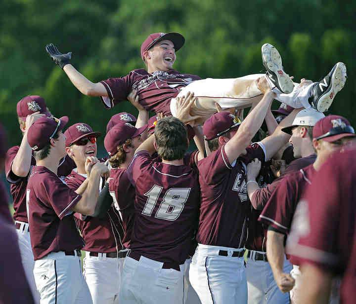New Albany's Spencer Tammaro (19) is tossed into the air after his game winning hit to beat Olentangy during the Division I regional semifinal game at Dublin Coffman High School.  (Kyle Robertson / The Columbus Dispatch)